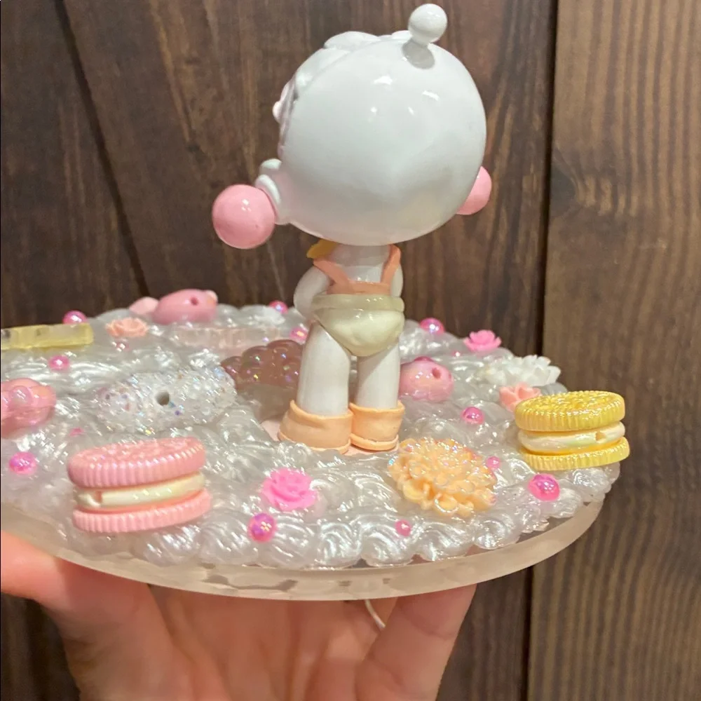 Charming Figurine with Candy and Floral Details